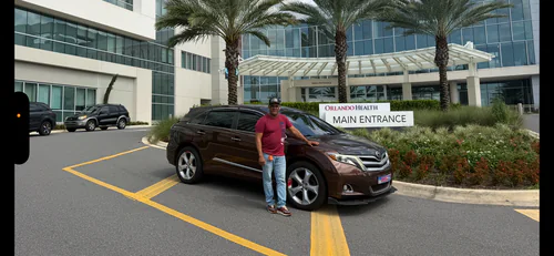 Comfort Ride Transportation vehicle waiting at the Orlando Health main entrance in Orlando