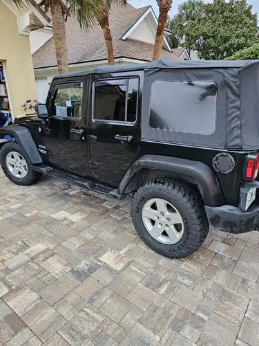 Black Jeep parked in a Sanford driveway for an at-home non-emergency medical transportation pickup