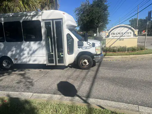 Comfort Ride Transportation shuttle bus parked outside Orange City Nursing and Rehab Center